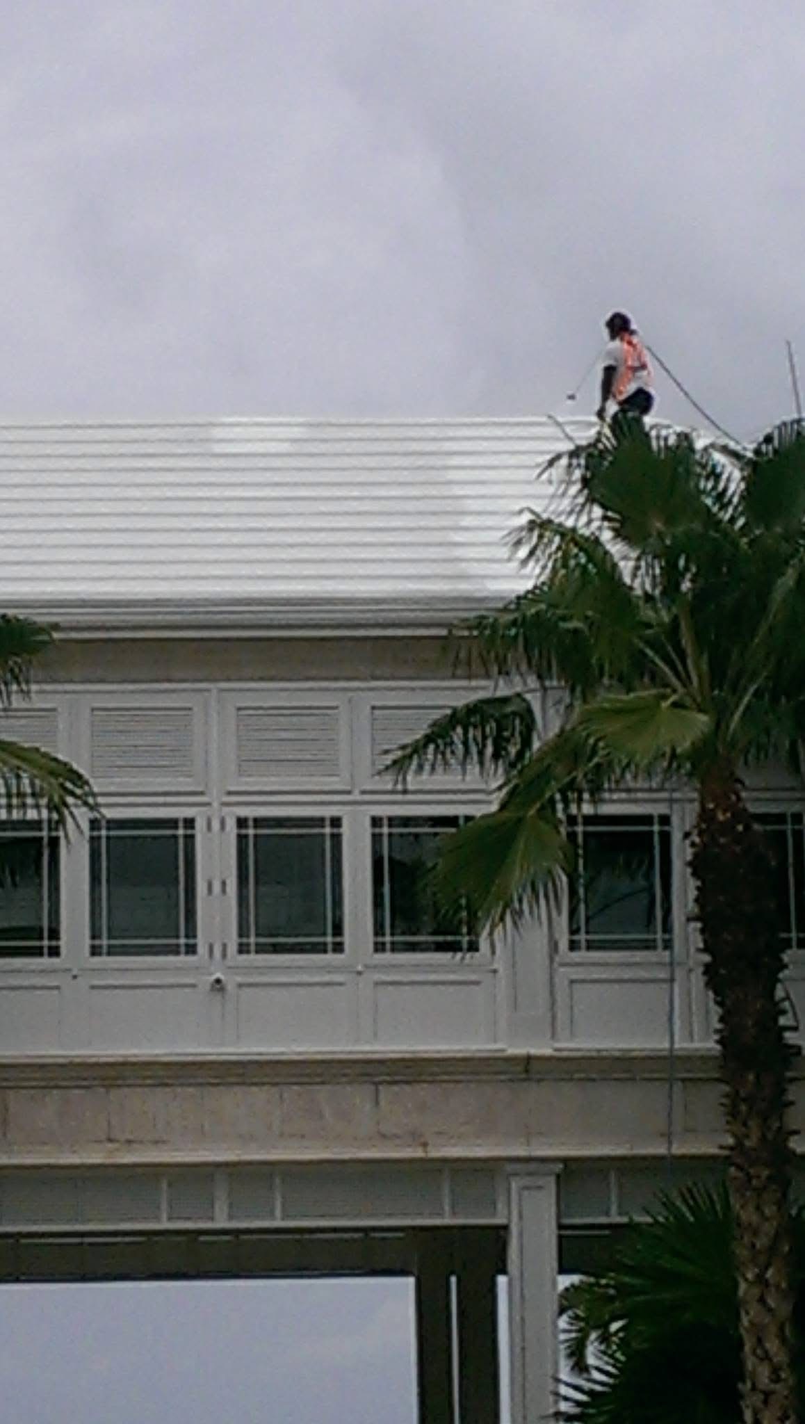 Bermuda roof cleaning in progress — Old Fort Bay, Nassau